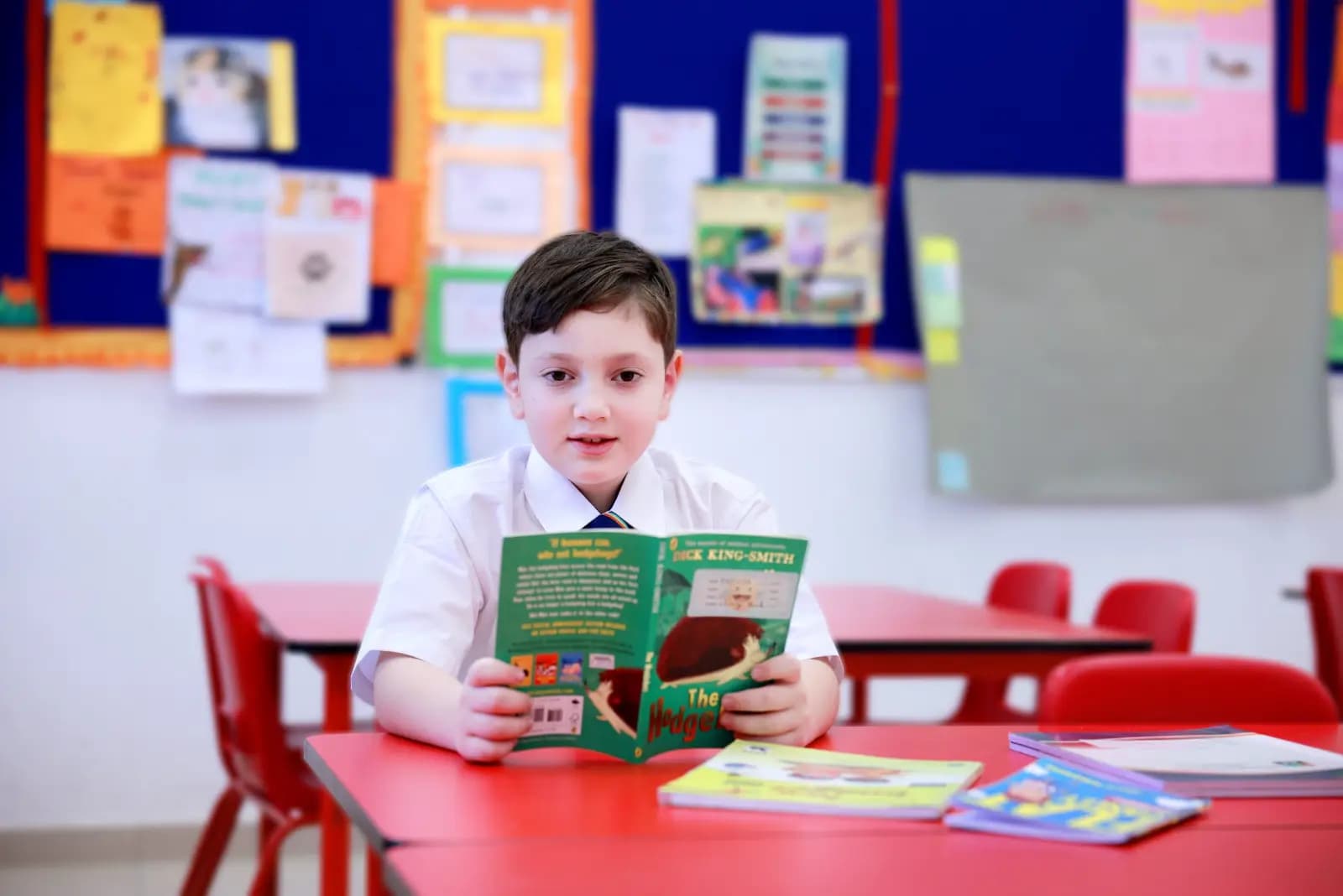 Young learner reading in class