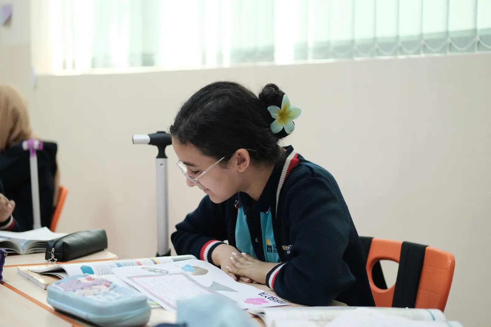 Student reading at her desk