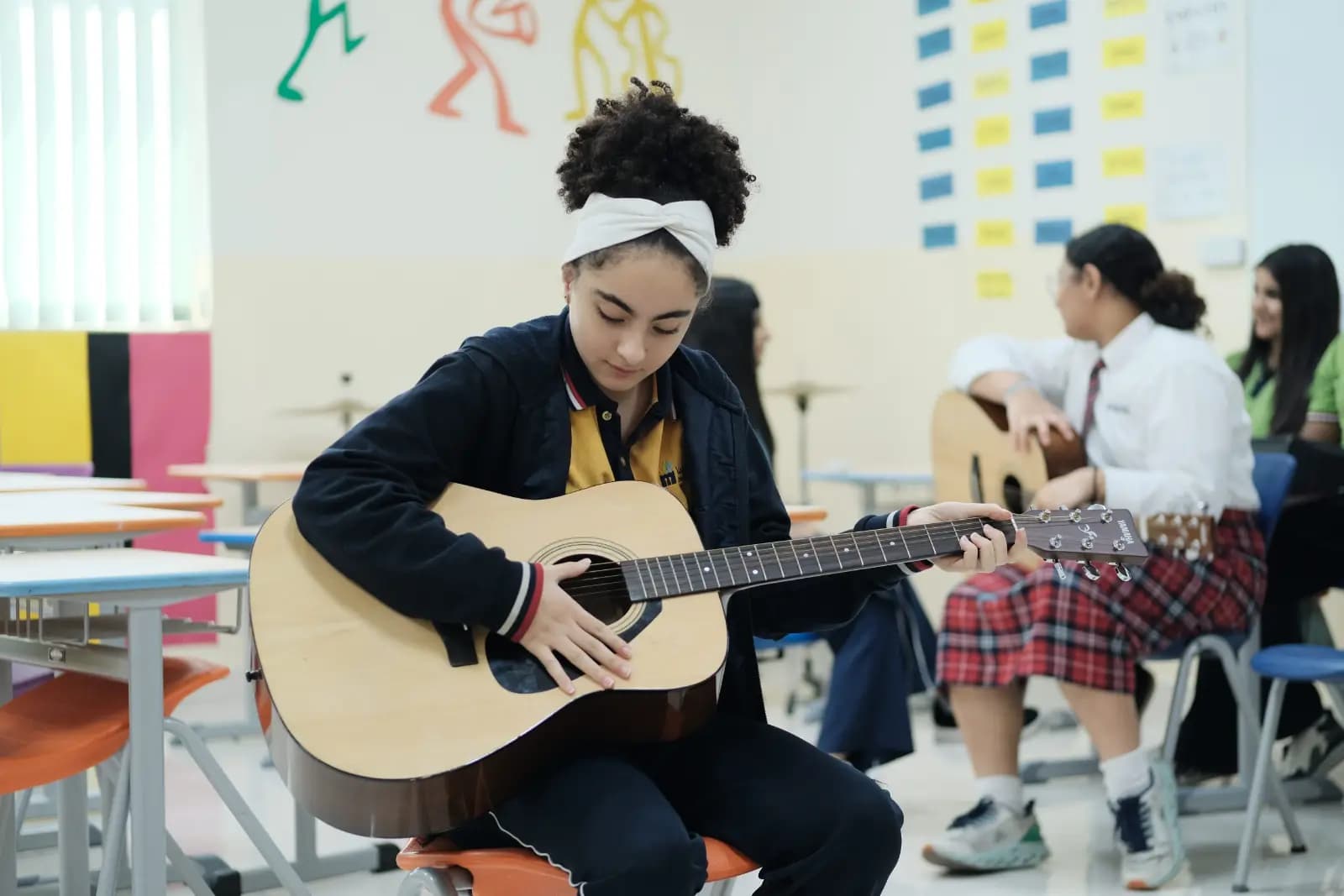 Student playing guitar