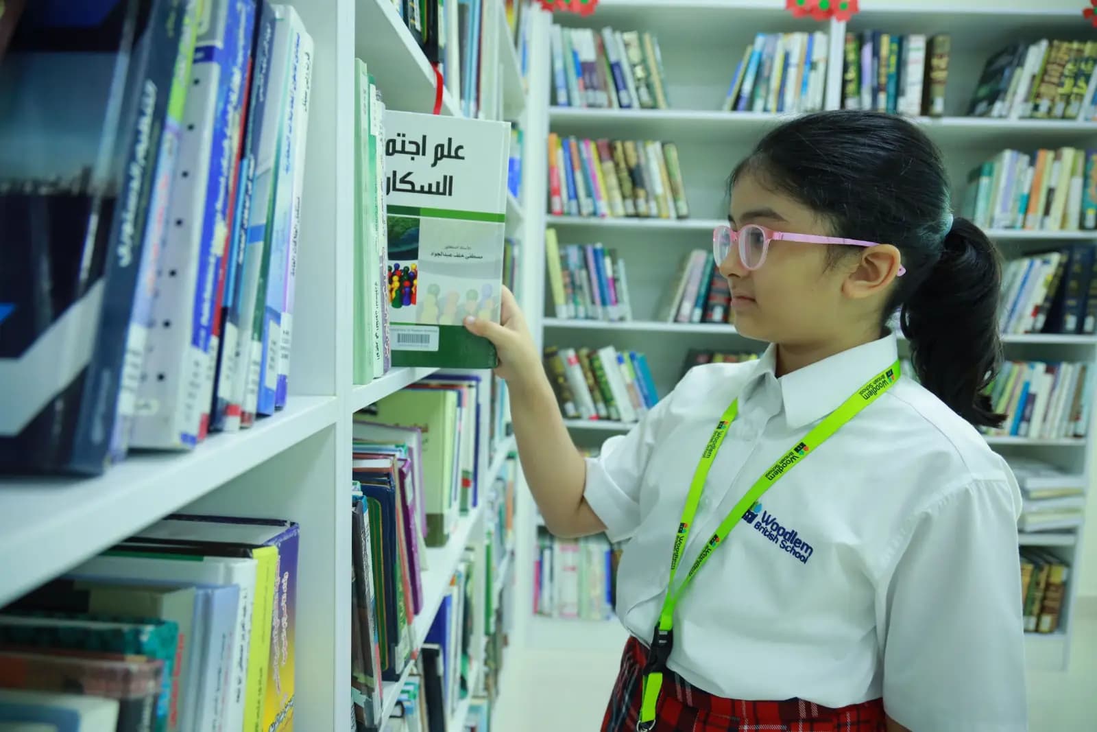 Student browsing library shelves