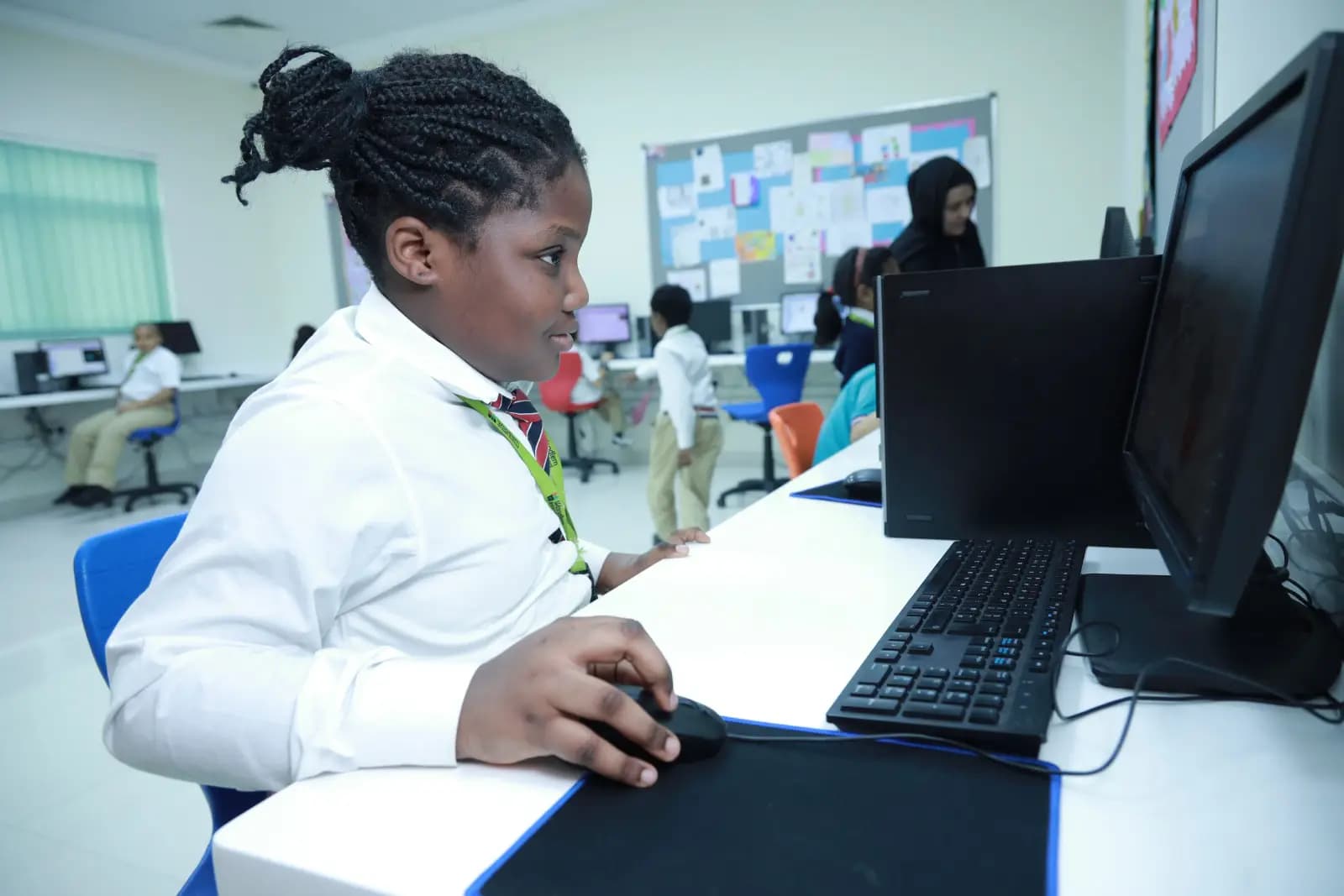 Student coding on a computer