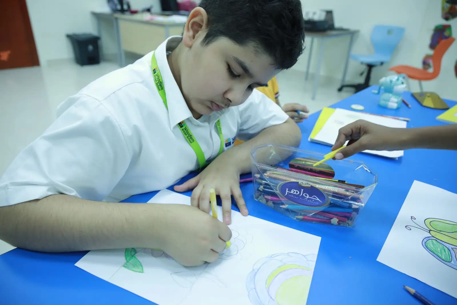 Pupils drawing in an art lesson