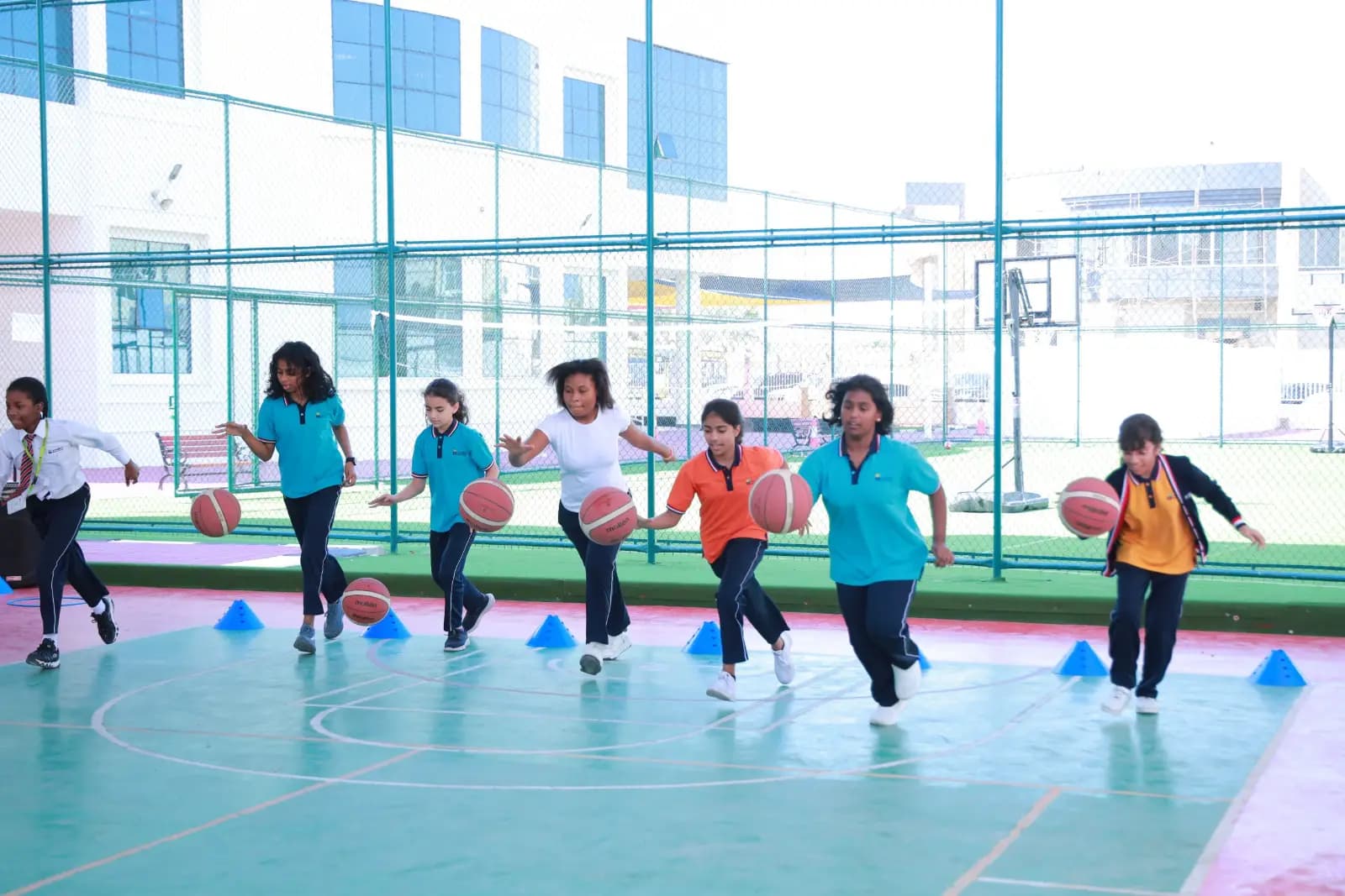Students running on the sports court